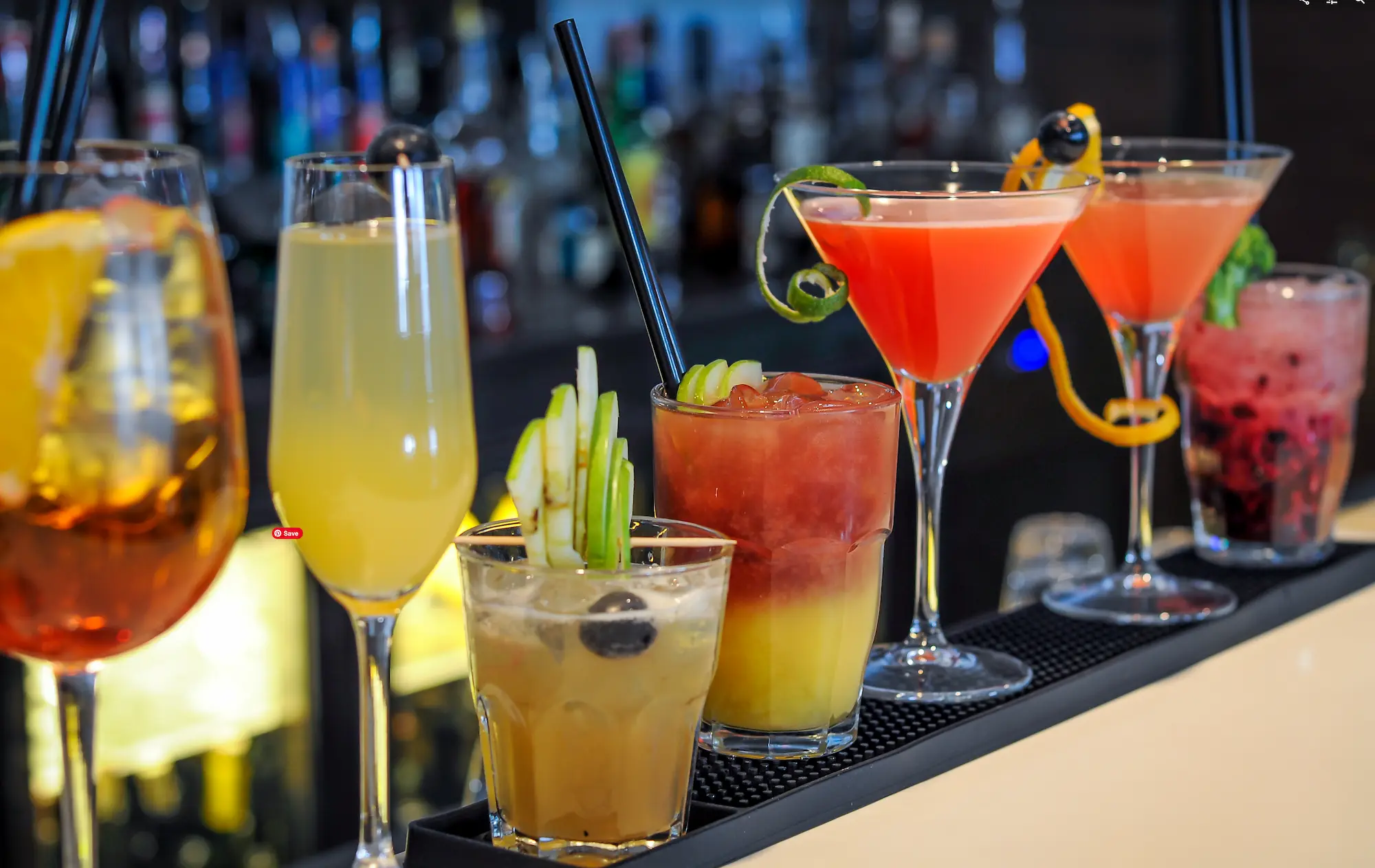 various cocktail drinks on a bar