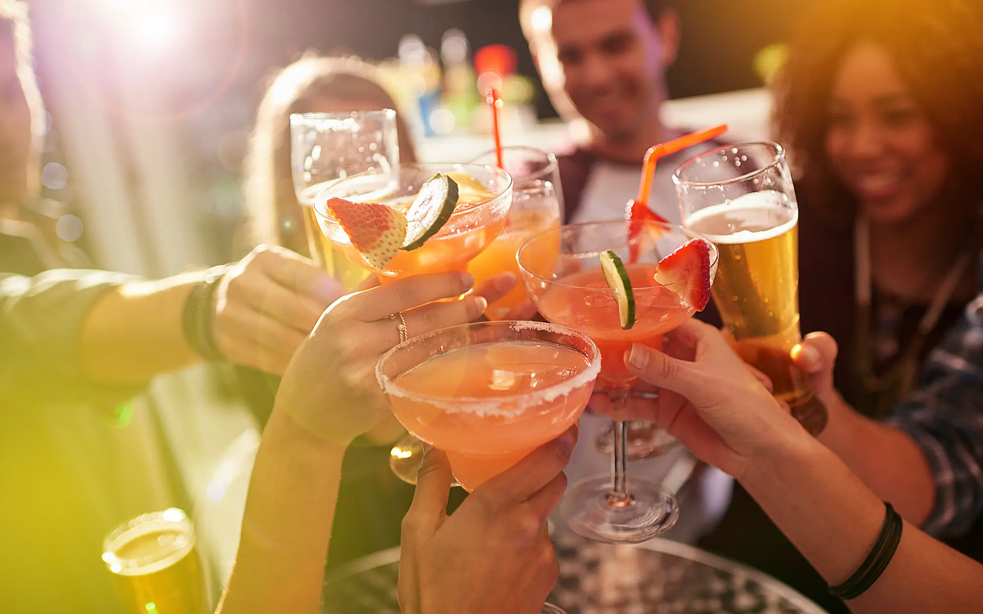 picture of people cheering with various drinks